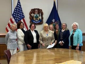 Sara Bloom and others with Governor Janet Mills.